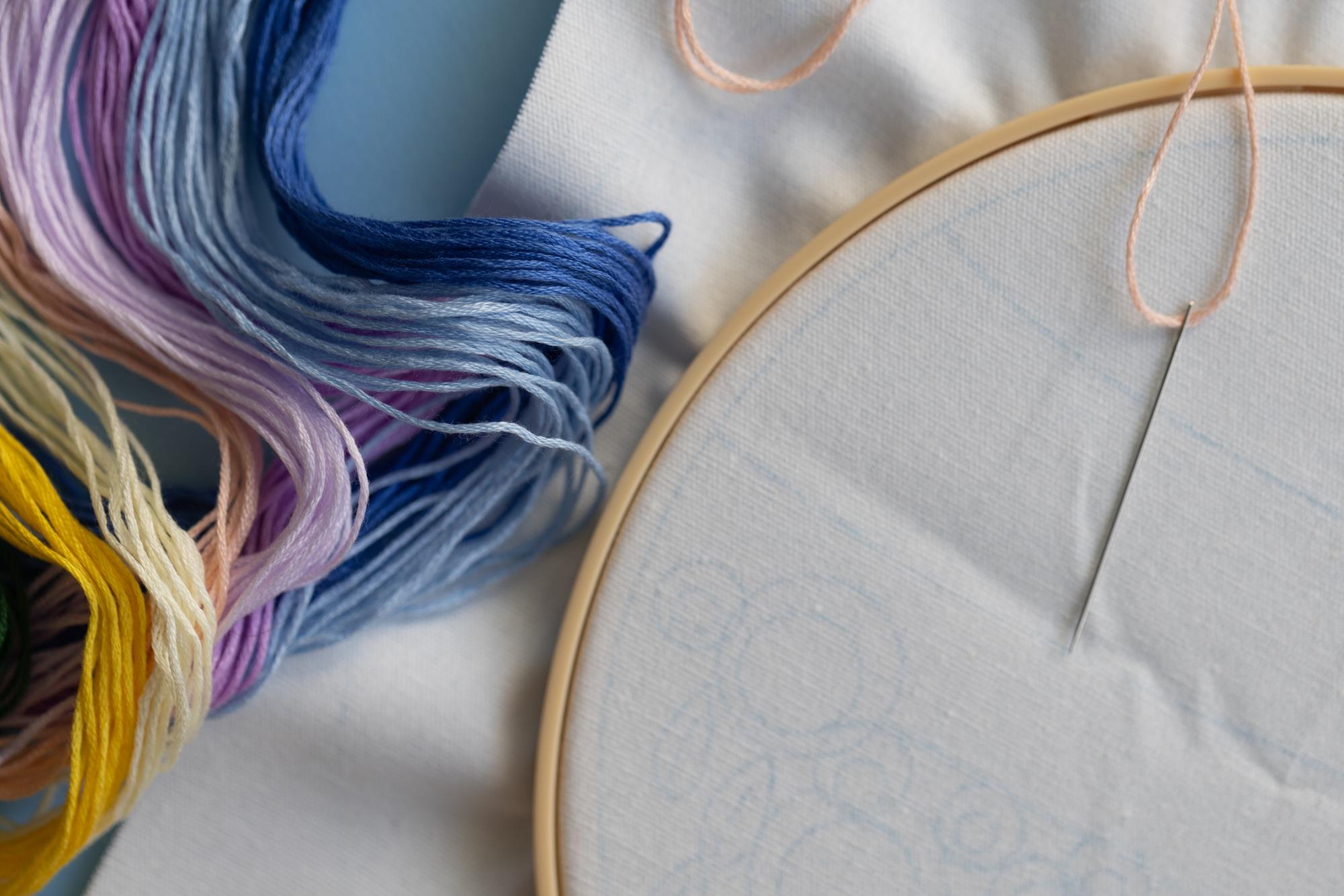 Close-up of contemporary embroidery on linen